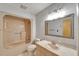 Bathroom with bathtub, vanity, and a mirror at 1414 75Th Nw St, Bradenton, FL 34209