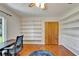 Bedroom with shelving, closet, and ceiling fan at 1414 75Th Nw St, Bradenton, FL 34209