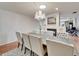 Elegant dining area with hardwood floors, a chandelier, and an adjacent fireplace feature at 1414 75Th Nw St, Bradenton, FL 34209