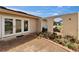 Covered home entrance with double doors, terracotta-colored pavers, and tropical plants at 1414 75Th Nw St, Bradenton, FL 34209