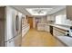 Spacious kitchen offers ample counter space, a refrigerator, and natural light at 1414 75Th Nw St, Bradenton, FL 34209