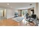 Bright living room with wood floors, aquarium, work space, and sliding doors to outdoor space at 1414 75Th Nw St, Bradenton, FL 34209