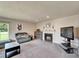 Living room features a modern fireplace and an entertainment system, creating a cozy atmosphere at 1414 75Th Nw St, Bradenton, FL 34209