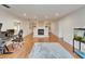 Open living space with hardwood floors, fireplace, neutral walls, and access to other living spaces at 1414 75Th Nw St, Bradenton, FL 34209