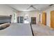 Well-lit main bedroom with two dressers, carpet, and access to the bathroom at 1414 75Th Nw St, Bradenton, FL 34209