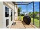 Screened-in lanai featuring a double-door entry and pet door at 1414 75Th Nw St, Bradenton, FL 34209