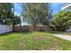 Expansive backyard featuring a large lawn area and a wooden fence, providing privacy and ample space at 1420 Temple St, Clearwater, FL 33756