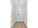 The laundry room has wood floors and bright walls at 1420 Temple St, Clearwater, FL 33756
