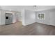 Bright living room featuring modern flooring, stainless steel appliances, and ample natural light at 1420 Temple St, Clearwater, FL 33756
