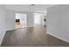 Open-concept living room showcasing modern flooring and seamless transition to other living spaces at 1420 Temple St, Clearwater, FL 33756