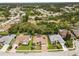 Aerial view of single Gathering homes in a beautiful community with green spaces, sidewalks, and mature landscaping at 14228 Teasdale Ave, Hudson, FL 34667