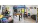 Spacious bedroom with a bunk bed over a foosball table and plenty of room for activities at 14228 Teasdale Ave, Hudson, FL 34667
