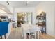Open dining room with tiled flooring and access to lanai at 14228 Teasdale Ave, Hudson, FL 34667