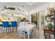 Open dining area featuring a view of the kitchen and an adjacent loft area at 14228 Teasdale Ave, Hudson, FL 34667