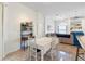 Dining area featuring tile floors and seamless flow to living room at 14228 Teasdale Ave, Hudson, FL 34667