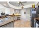 Bright kitchen offering granite countertops and tiled floors at 14228 Teasdale Ave, Hudson, FL 34667