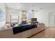 Comfortable living room with fireplace and arched windows, creating a relaxing atmosphere at 14228 Teasdale Ave, Hudson, FL 34667