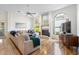 Bright living room with large windows, fireplace, and hardwood floors at 14228 Teasdale Ave, Hudson, FL 34667