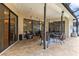 Outdoor patio featuring neutral tile, ceiling fans, and comfortable seating area at 14228 Teasdale Ave, Hudson, FL 34667