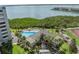Aerial view of the condo's location near the water with a community pool at 1501 Gulf Blvd # 201, Clearwater Beach, FL 33767
