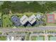 Aerial view of a condo, parking, community pool and tennis courts at 1501 Gulf Blvd # 201, Clearwater Beach, FL 33767