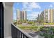 Balcony area offering a scenic view of the ocean, lush greenery, and city view at 1501 Gulf Blvd # 201, Clearwater Beach, FL 33767