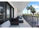 Balcony area with cushioned seating offers a cozy spot to enjoy the outdoors at 1501 Gulf Blvd # 201, Clearwater Beach, FL 33767