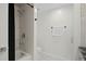 Clean, bright bathroom with a tub/shower combo, towel rack, toilet, and access to the vanity area at 1501 Gulf Blvd # 201, Clearwater Beach, FL 33767