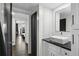 Updated bathroom featuring a modern vanity, white subway tile, and entry to the bedroom at 1501 Gulf Blvd # 201, Clearwater Beach, FL 33767