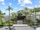Stunning exterior view of the property with lush landscaping and mature palm trees at 1501 Gulf Blvd # 201, Clearwater Beach, FL 33767