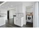 Convenient laundry area with washer and dryer, integrated cabinets, and marble countertops at 1501 Gulf Blvd # 201, Clearwater Beach, FL 33767