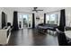 Chic living room featuring dark wood floors, and a stylish sectional sofa, with a balcony at 1501 Gulf Blvd # 201, Clearwater Beach, FL 33767