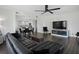 Open-concept living room featuring dark wood floors, modern furnishings, and a view into the updated kitchen at 1501 Gulf Blvd # 201, Clearwater Beach, FL 33767