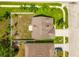 Aerial view of the house showcasing the roof, lawn, driveway, and the surrounding neighborhood at 17342 Lawn Orchid Loop, Land O Lakes, FL 34638