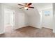 Bedroom with ceiling fan, closet, neutral carpet, and bright walls, providing a comfortable and inviting space at 17342 Lawn Orchid Loop, Land O Lakes, FL 34638