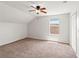 Bedroom features neutral carpet, a ceiling fan, and a window for natural light at 17342 Lawn Orchid Loop, Land O Lakes, FL 34638