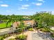 Community clubhouse with beautiful landscaping, convenient parking, and community playground at 17342 Lawn Orchid Loop, Land O Lakes, FL 34638