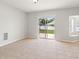 Bright dining area with a sliding glass door and tiled flooring at 17342 Lawn Orchid Loop, Land O Lakes, FL 34638