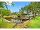 Backyard with a boat dock and lake access, perfect for enjoying waterfront activities and serene views at 18202 Abbey Ln, Lutz, FL 33548
