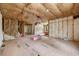 Unfinished basement space, revealing insulation and framing, offering a blank canvas for customization and future living space at 18202 Abbey Ln, Lutz, FL 33548