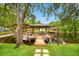 Picturesque boat dock with covered seating area, perfect for relaxing and enjoying waterfront living at 18202 Abbey Ln, Lutz, FL 33548