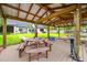 Waterfront boat dock featuring a picnic table and direct access to the lake, perfect for boating at 18202 Abbey Ln, Lutz, FL 33548