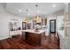 Beautiful kitchen featuring a large island with marble countertops, custom cabinets, and stainless steel appliances at 18202 Abbey Ln, Lutz, FL 33548