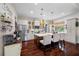 Spacious kitchen featuring a large island with seating, stainless steel appliances and a coffee bar at 18202 Abbey Ln, Lutz, FL 33548