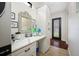 Bright laundry area with white cabinetry, countertop space, and decor at 18202 Abbey Ln, Lutz, FL 33548