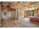 Living room reveals a work-in-progress area with new flooring, ready for transformation and final touches at 18202 Abbey Ln, Lutz, FL 33548