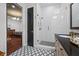 A view from the main bathroom, it has dual sinks, modern floors, and glass shower at 18202 Abbey Ln, Lutz, FL 33548