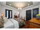 A view of the main bedroom with hardwood floors, recessed lighting, and furniture at 18202 Abbey Ln, Lutz, FL 33548
