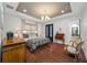This main bedroom features a hardwood floor and a beautiful chandelier at 18202 Abbey Ln, Lutz, FL 33548