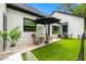 A cozy outdoor patio featuring comfortable seating and a stylish umbrella for enjoying the outdoors at 18202 Abbey Ln, Lutz, FL 33548